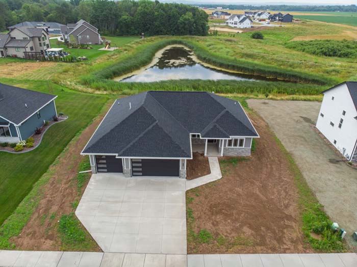Outdoor overhead view of 1903 Wizard Way with pond in the backyard